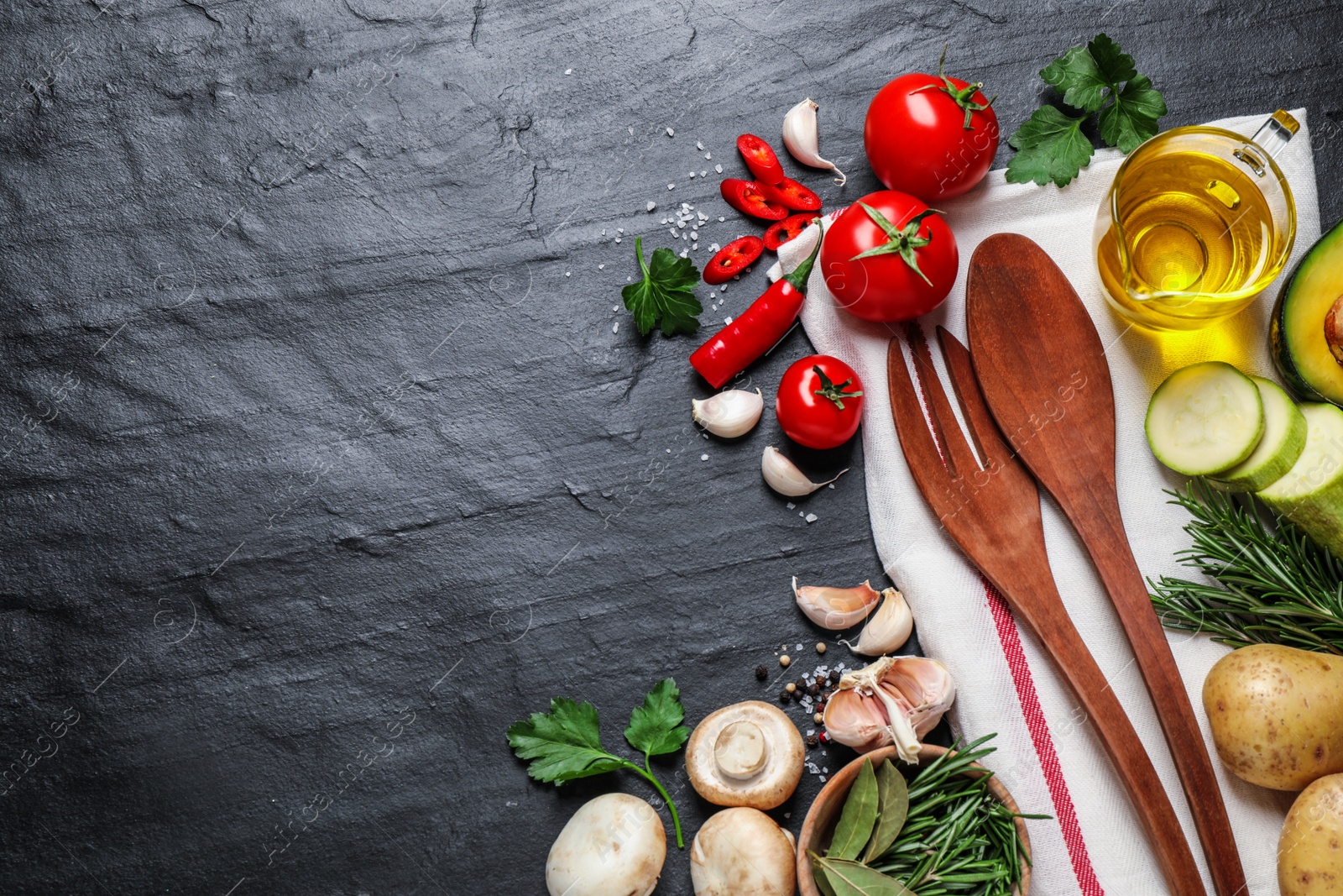 Photo of Flat lay composition with fresh products on grey table, space for text. Healthy cooking