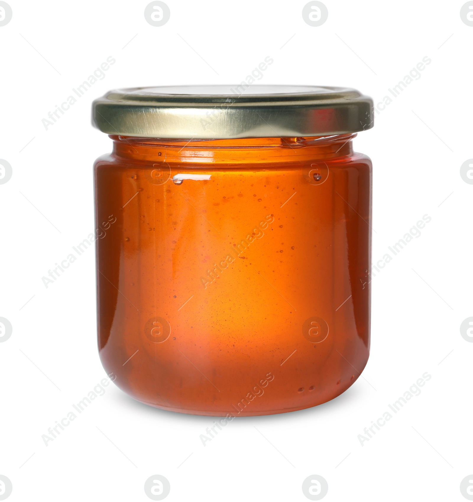 Photo of Tasty natural honey in glass jar isolated on white