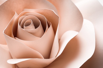 Photo of Beautiful beige flower made of paper as background, closeup