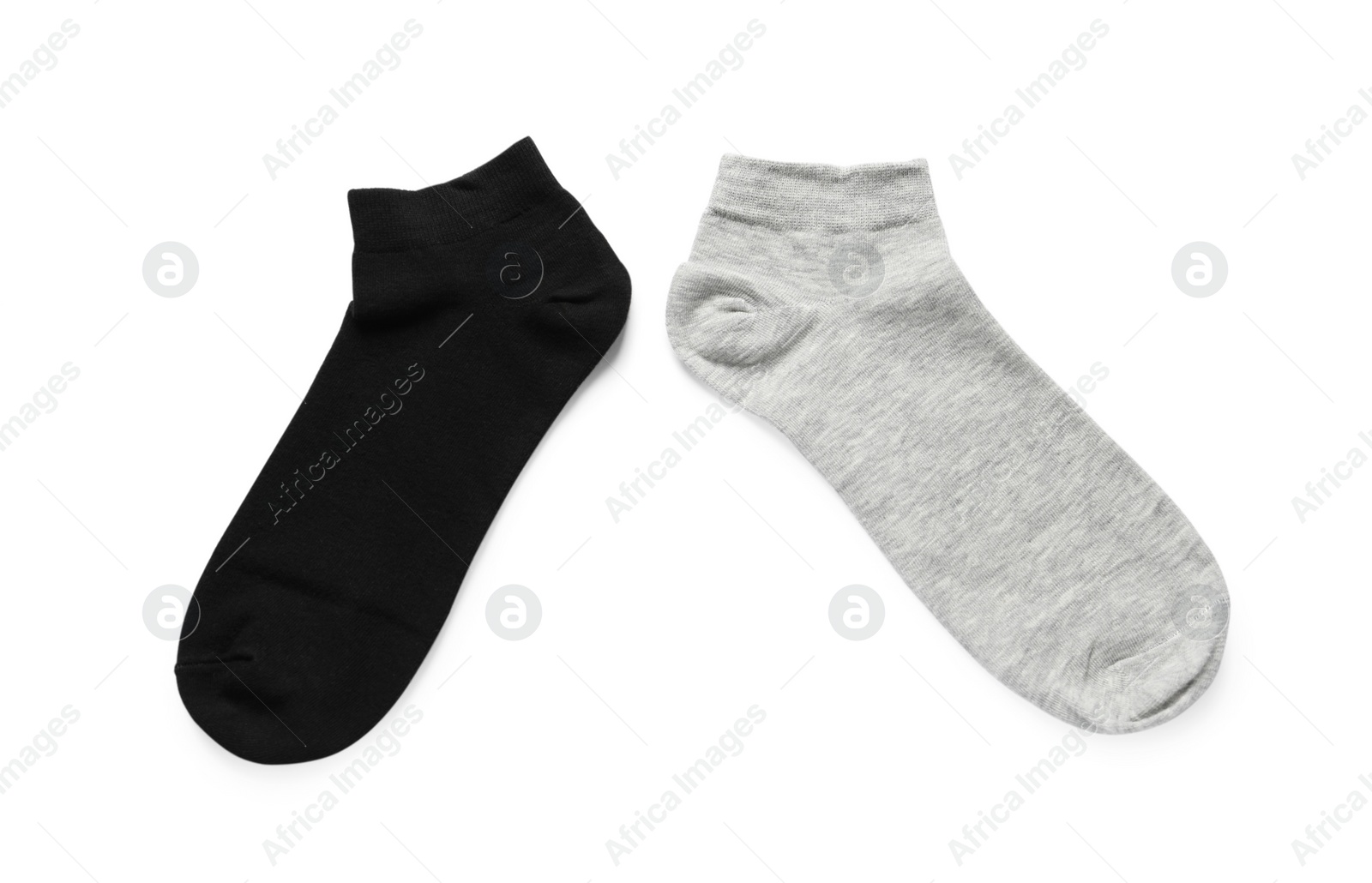 Photo of Different socks isolated on white, top view