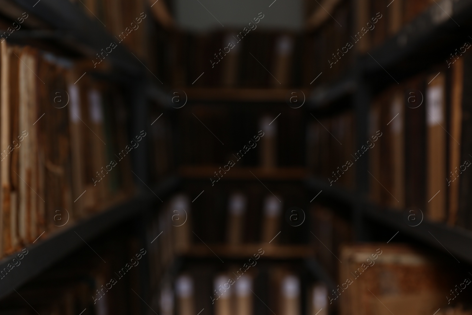 Photo of Blurred view of different books on shelves in library