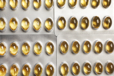 Photo of Packages with cod liver oil pills, top view