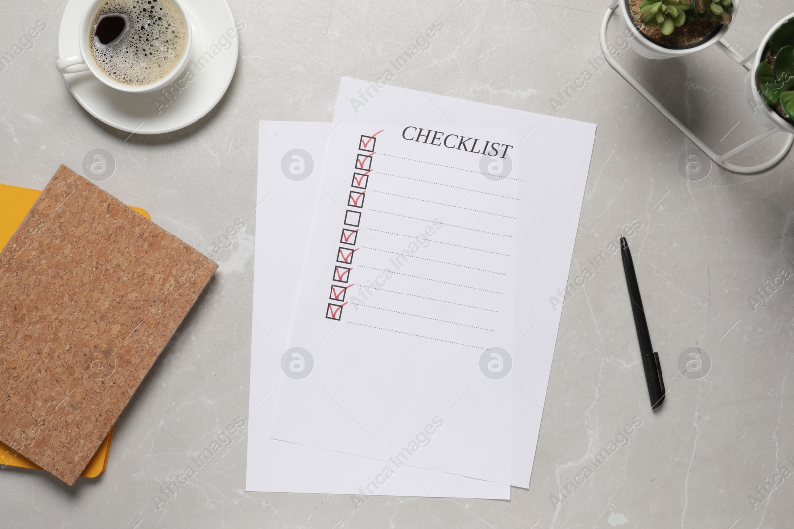 Photo of Paper sheet with inscription Checklist, cup of coffee and plants on light grey table, flat lay