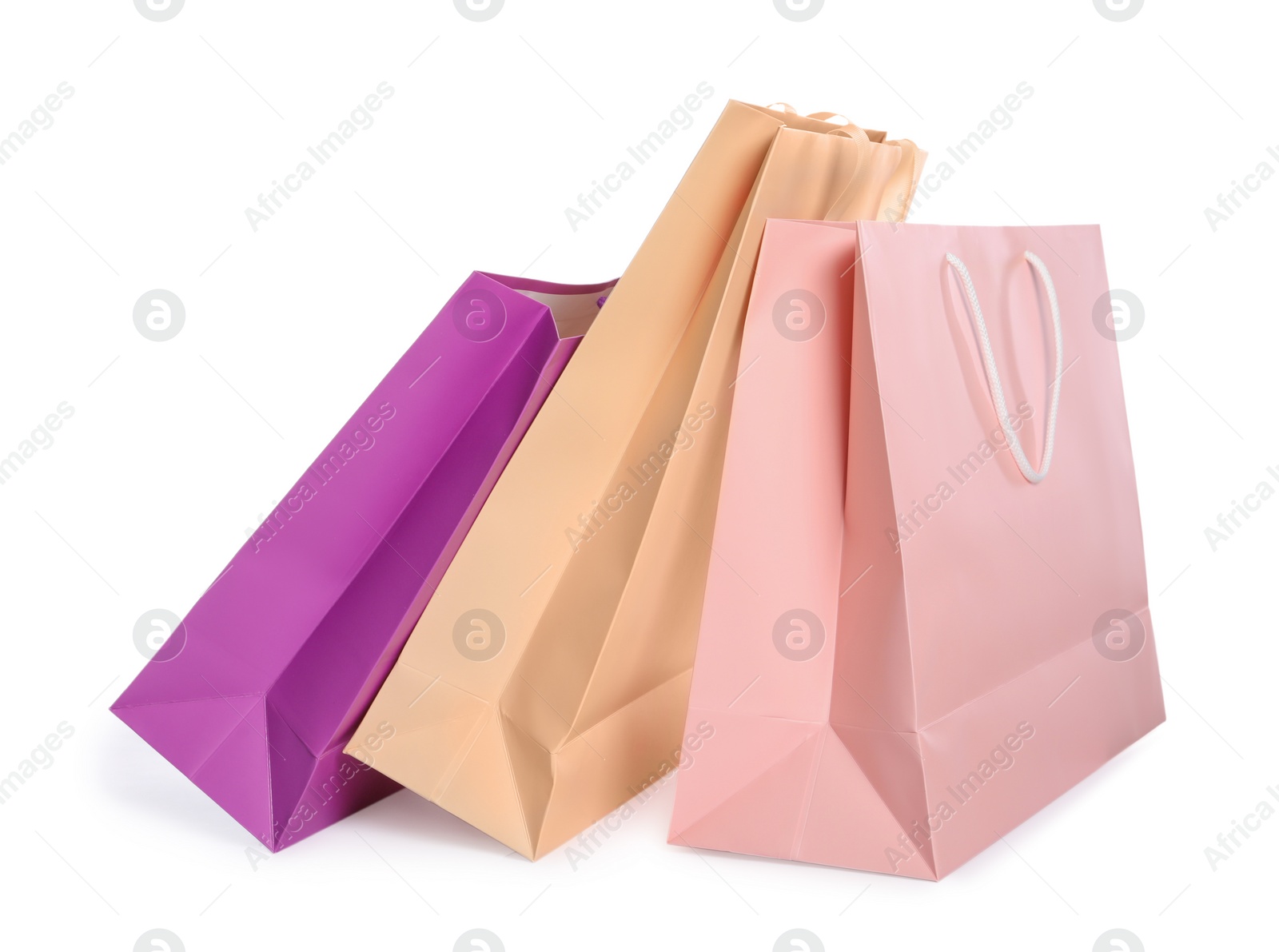 Photo of Colorful paper shopping bags isolated on white