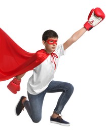 Teenage boy in superhero costume on white background