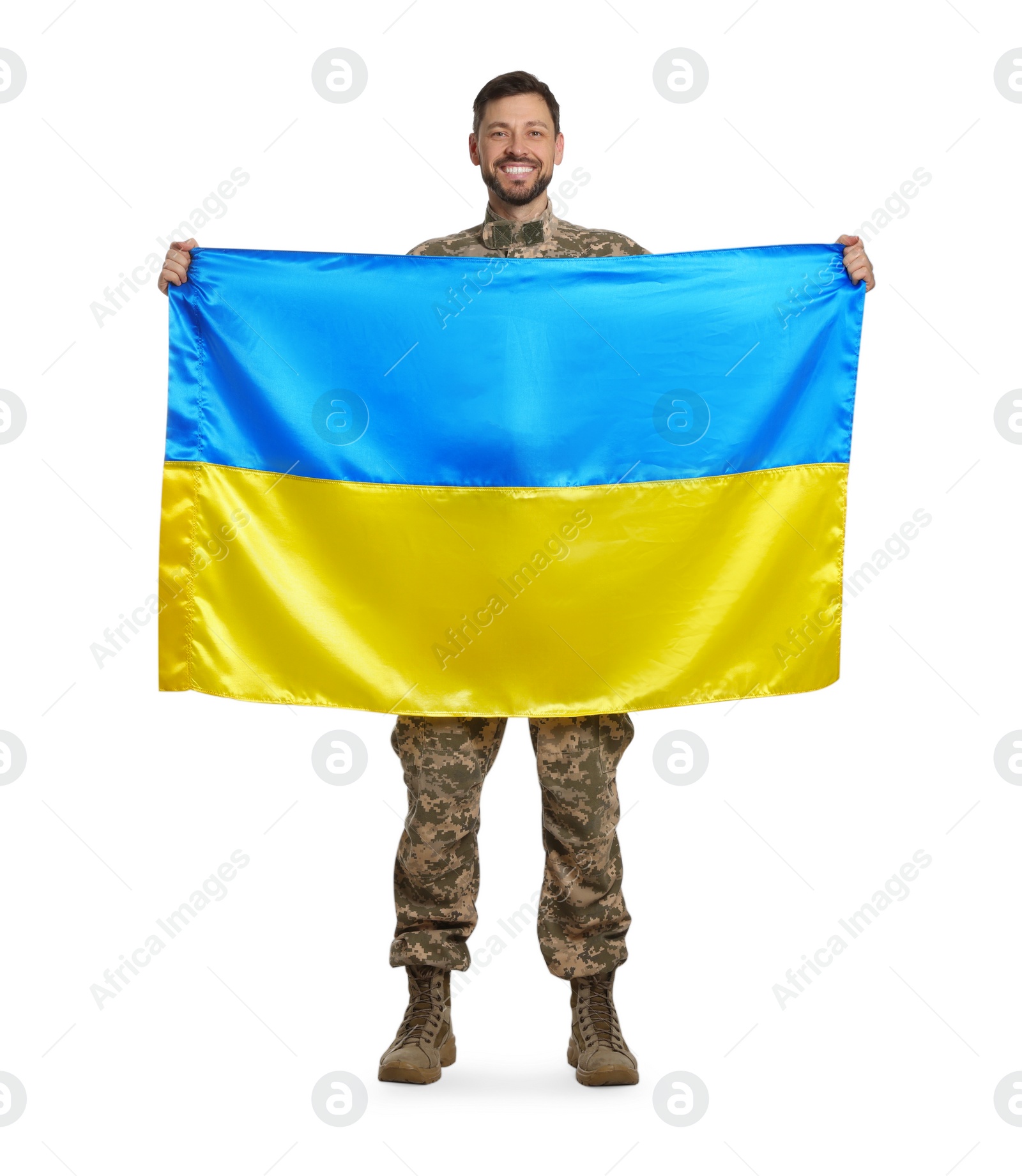 Photo of Soldier in military uniform with Ukrainian flag on white background