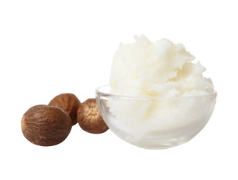 Shea butter in bowl and nuts isolated on white