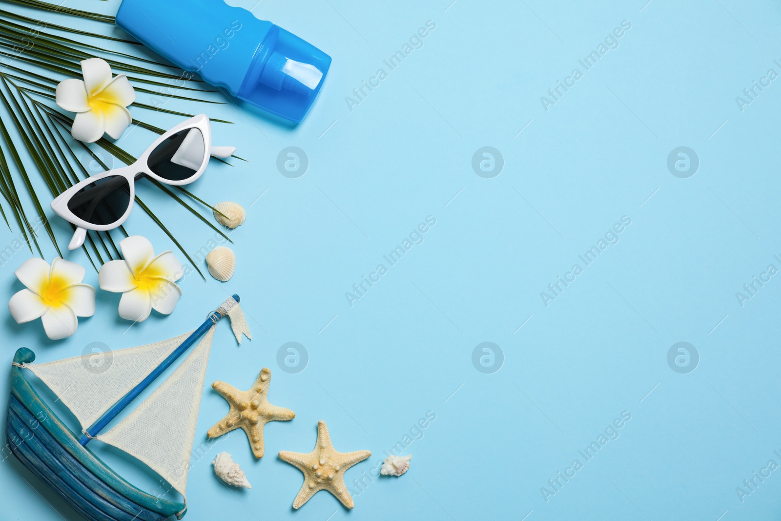 Photo of Flat lay composition with beach accessories on color background, space for text