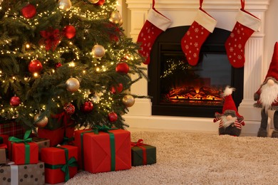 Photo of Living room interior with fireplace and festive decor. Christmas celebration