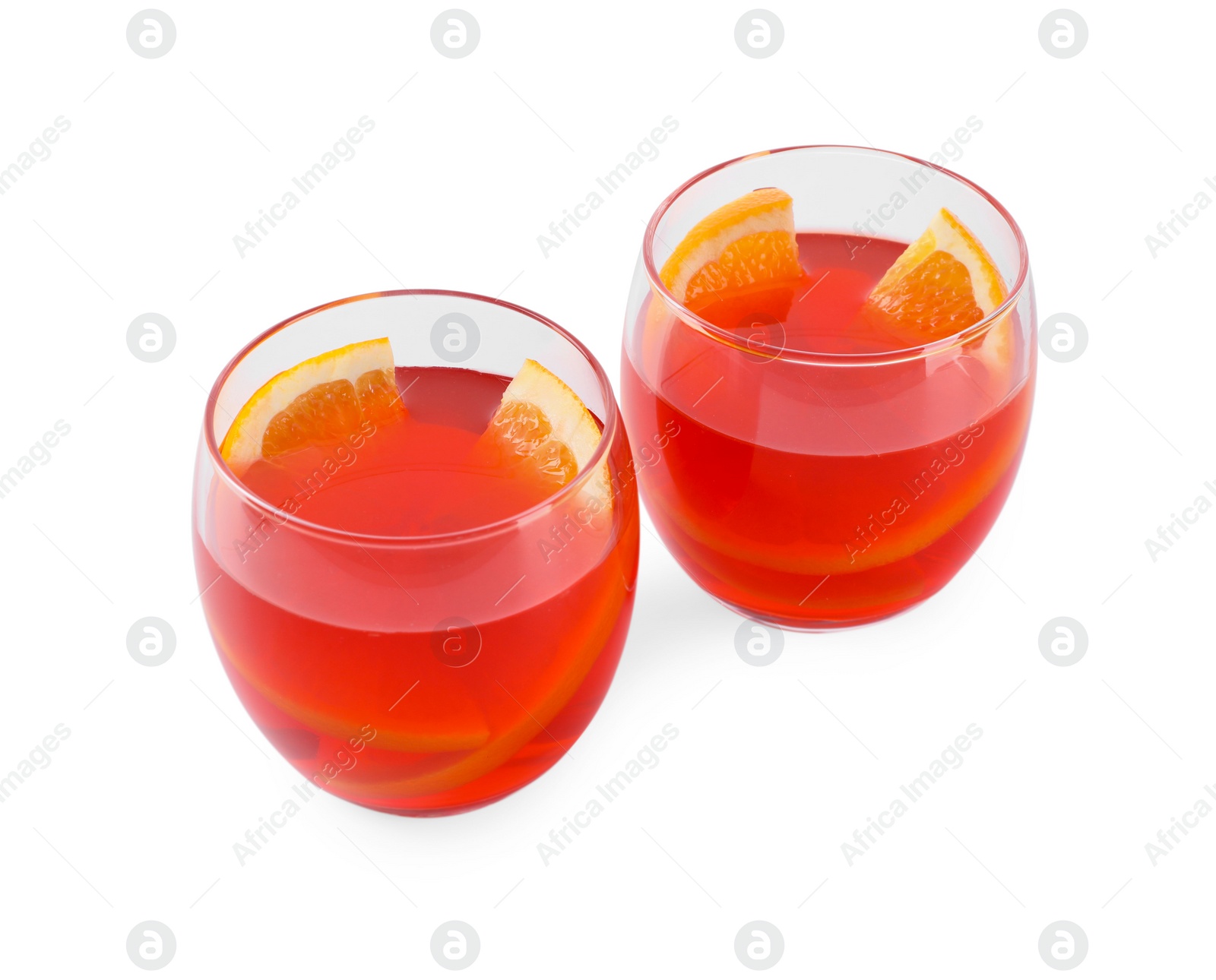 Photo of Aperol spritz cocktail and orange slices in glasses isolated on white