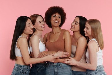 Portrait of beautiful young women on pink background