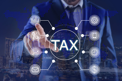 Image of Tax concept. Man using virtual screen, closeup