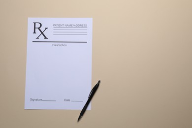Photo of Medical prescription form and pen on beige background, top view. Space for text