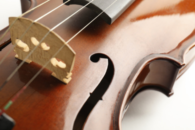 Photo of Beautiful classic violin, closeup view. Musical instrument