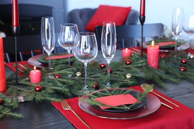 Elegant Christmas table setting with blank place card and festive decor
