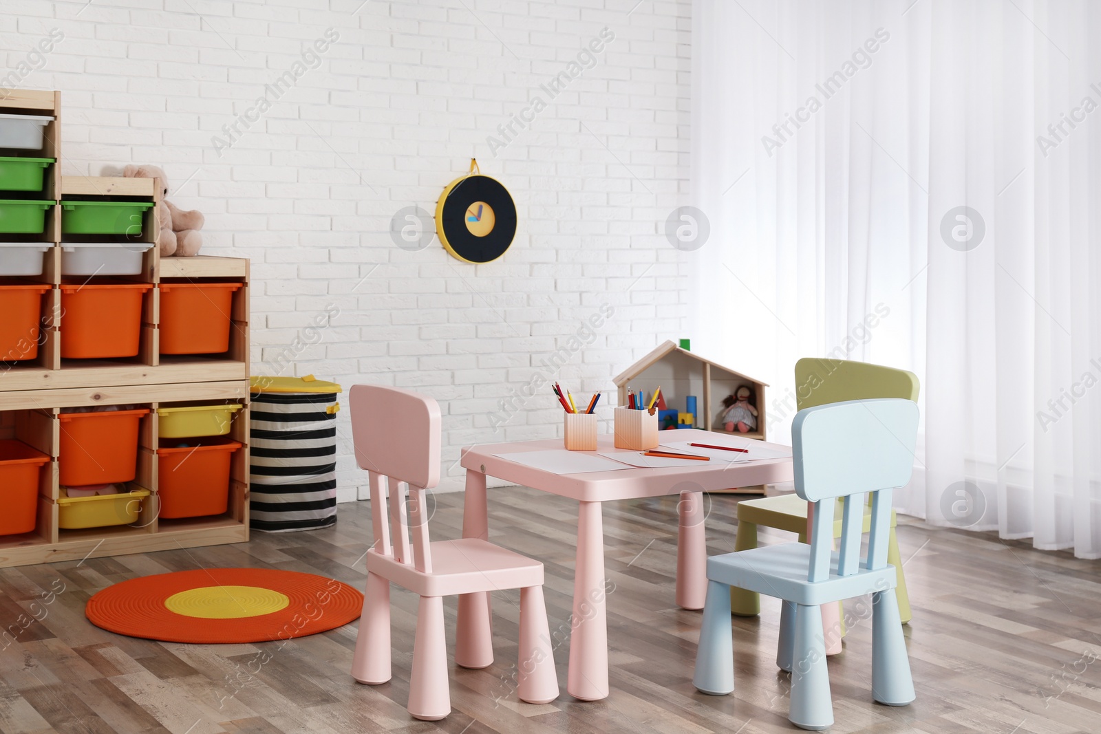 Photo of Modern child room interior with table and chairs