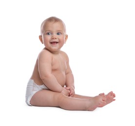 Photo of Cute baby in dry soft diaper sitting on white background