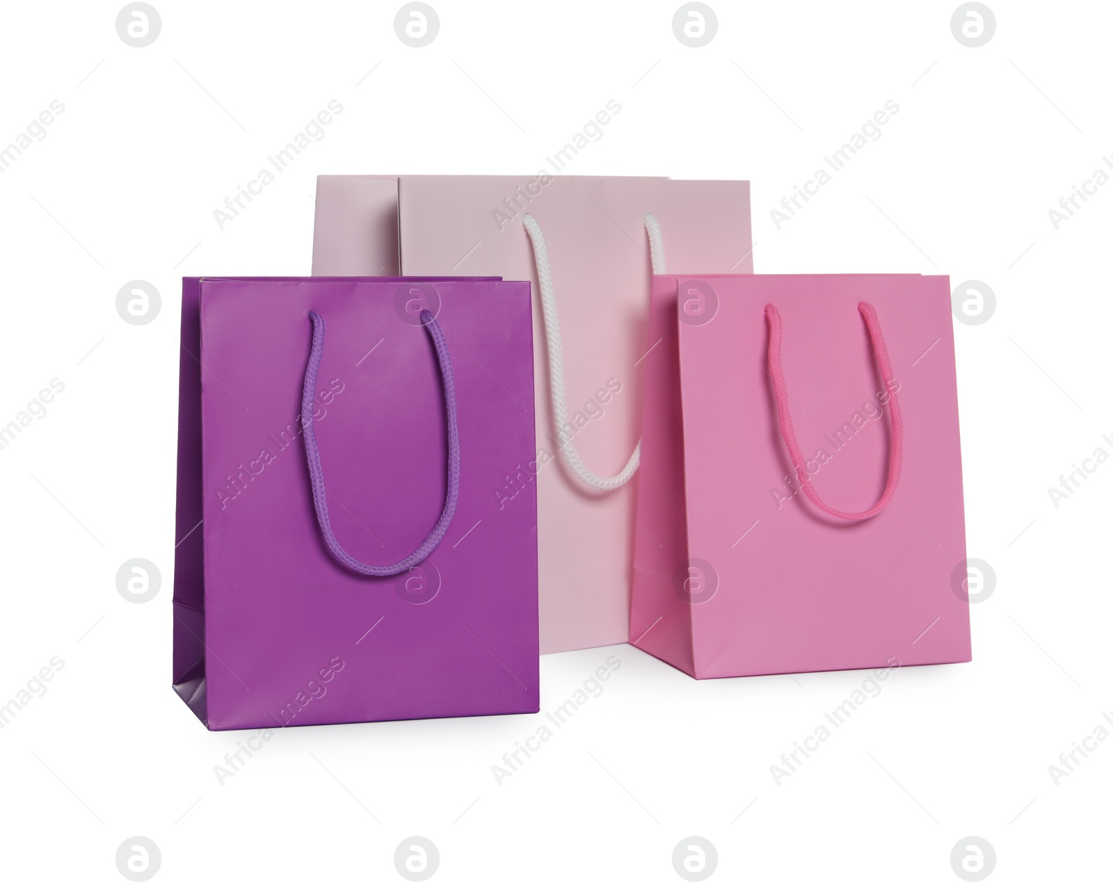 Photo of Colorful paper shopping bags isolated on white