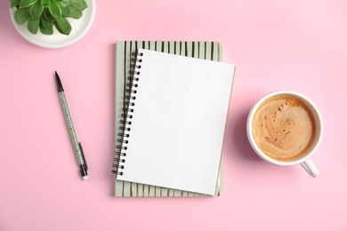 Photo of Flat lay composition with notebooks and coffee on color background