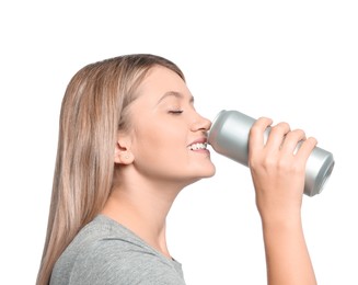 Photo of Beautiful woman drinking from beverage can on white background