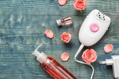 Photo of Set for epilation on wooden background, flat lay