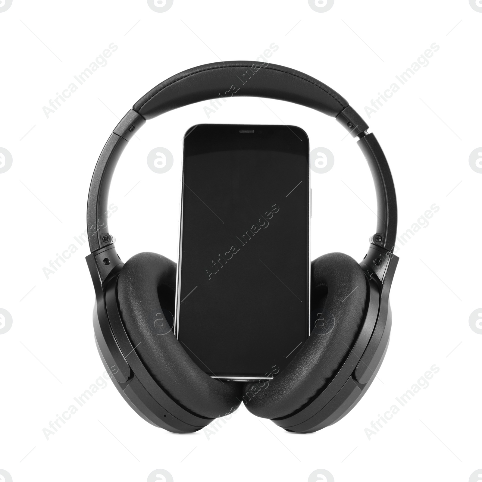 Photo of Modern wireless headphones and smartphone isolated on white