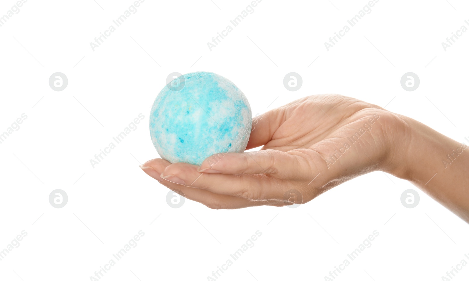 Photo of Woman holding bath bomb on white background, closeup