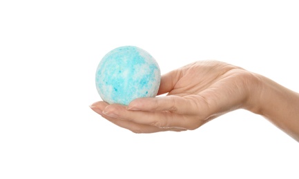 Woman holding bath bomb on white background, closeup