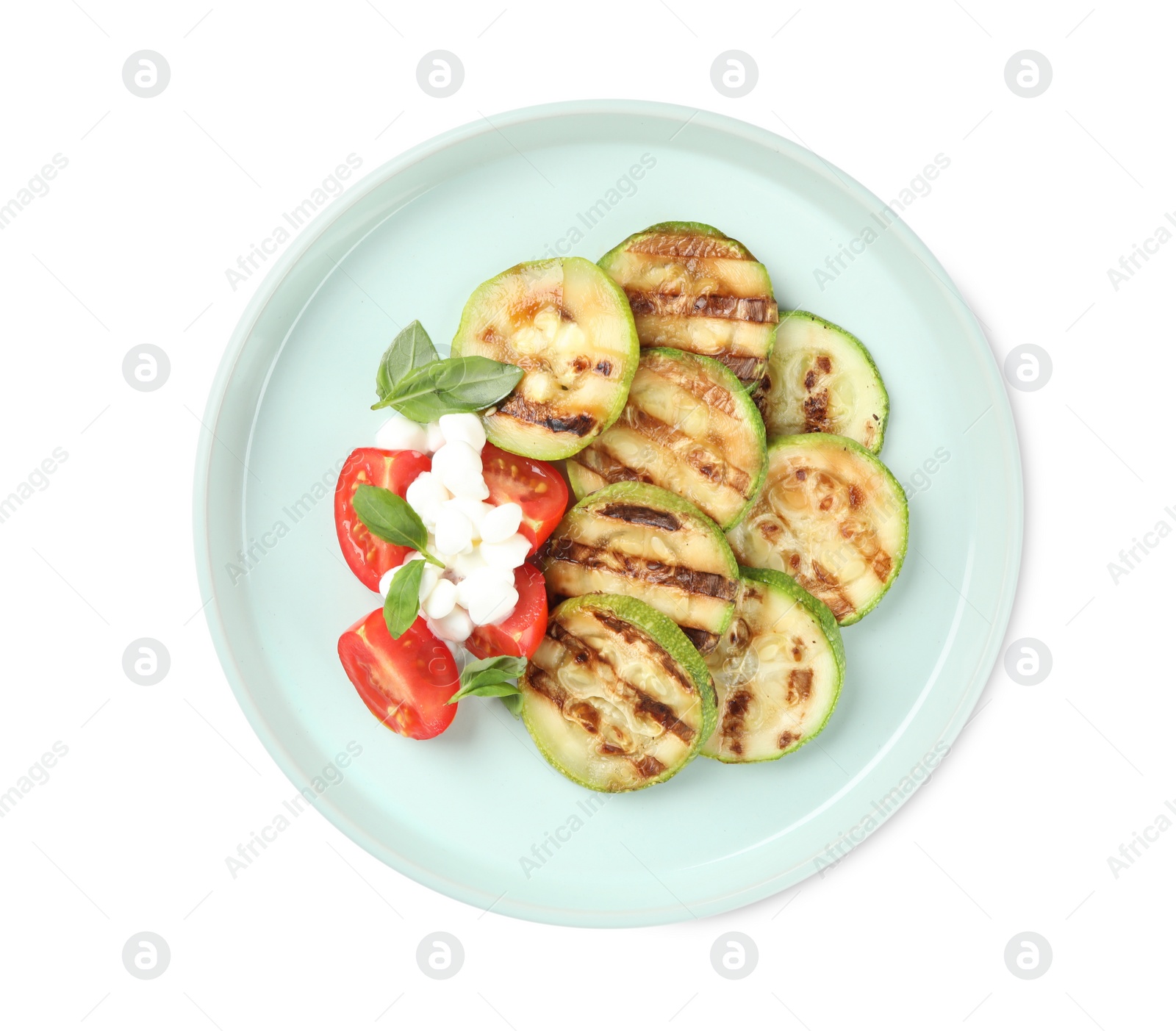 Photo of Delicious grilled zucchini slices served with cottage cheese and tomatoes on white background, top view