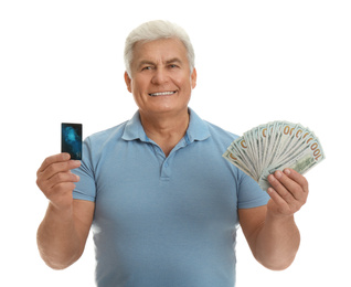 Happy senior man with cash money and credit card on white background
