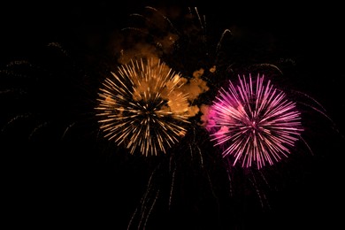 Image of Beautiful bright fireworks lighting up night sky