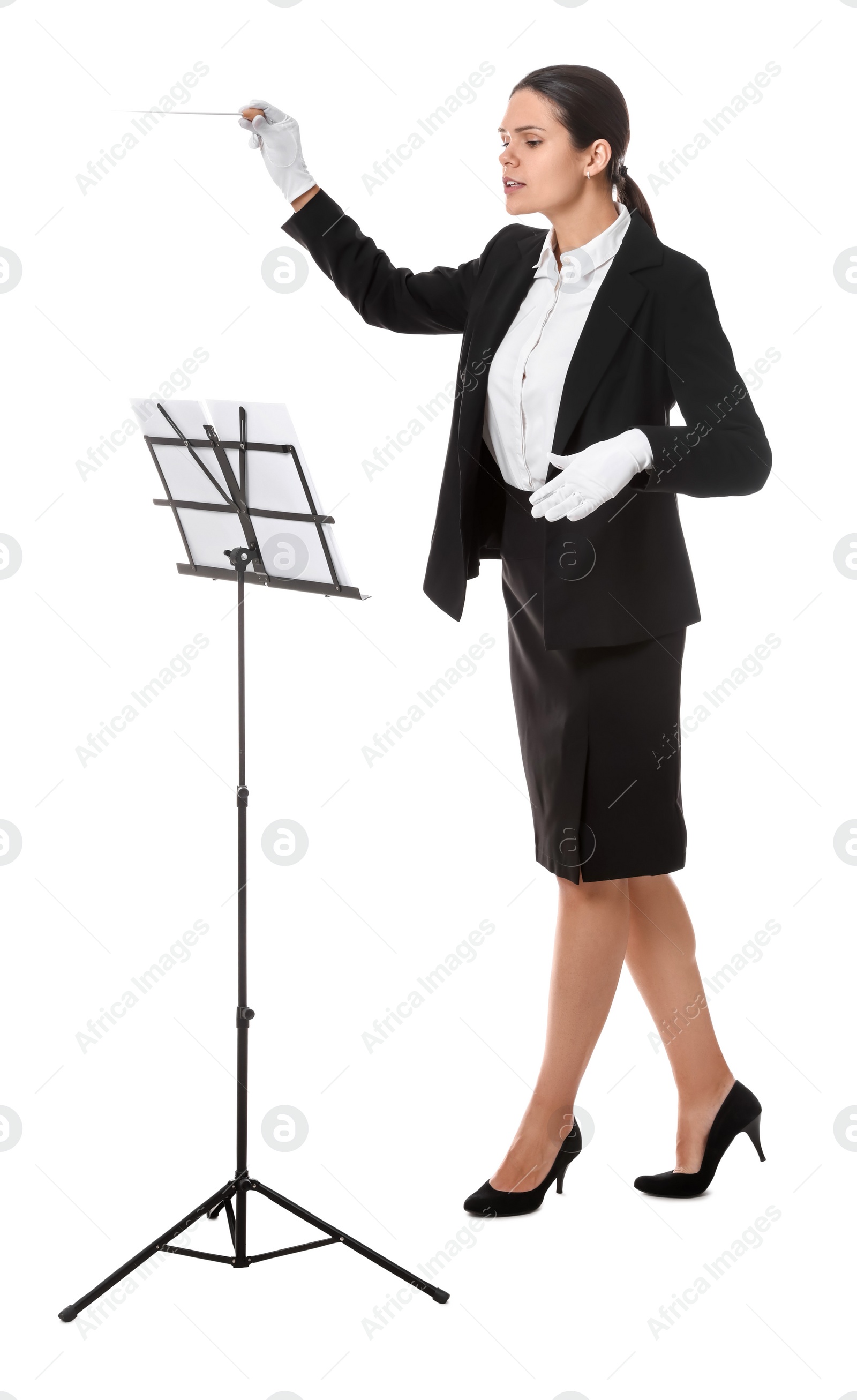 Photo of Professional conductor with baton and note stand on white background