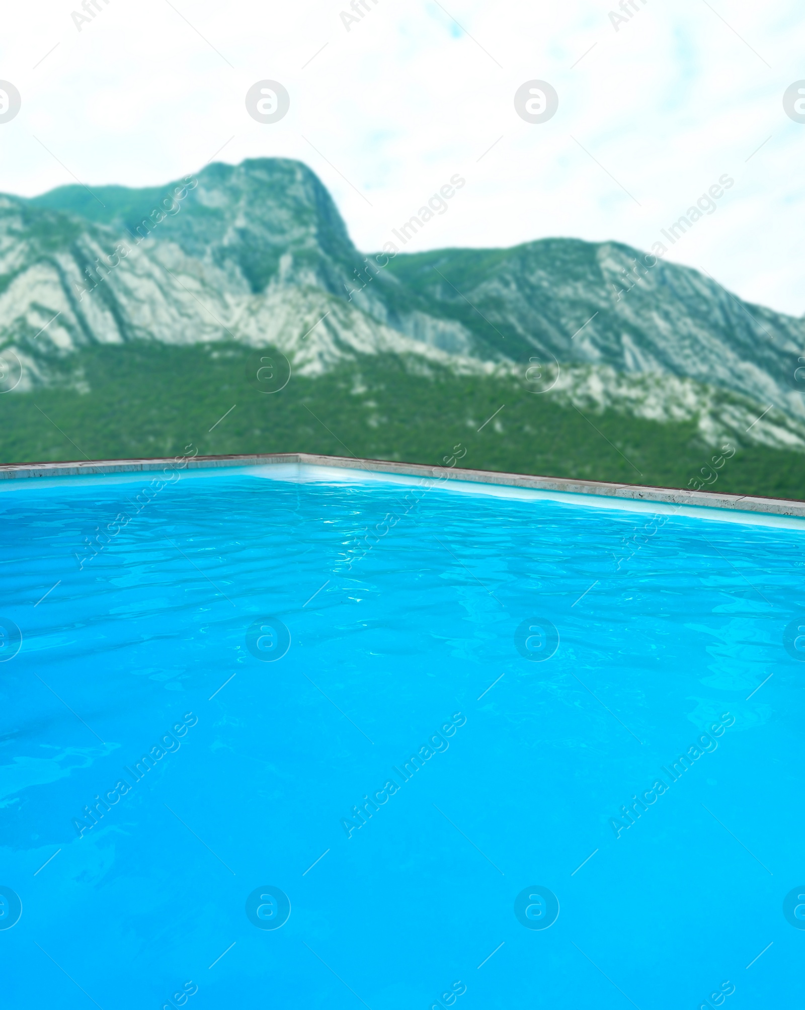 Image of Outdoor swimming pool at luxury resort with beautiful view of mountains