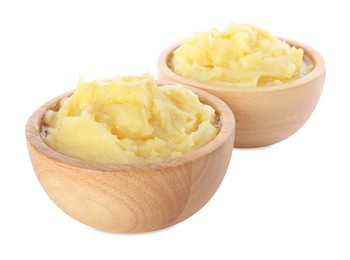 Photo of Bowls of tasty mashed potato isolated on white