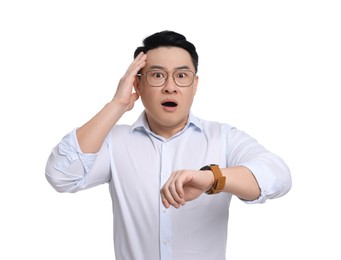 Shocked businessman with watch on white background