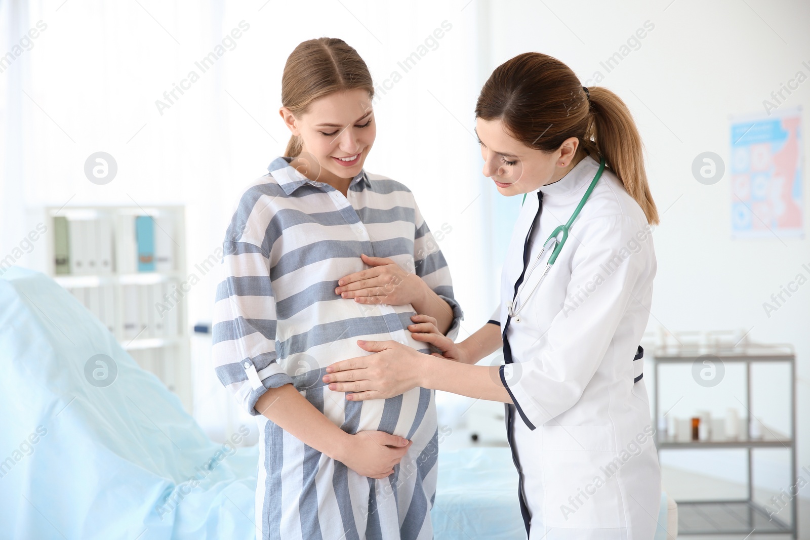 Photo of Gynecology consultation. Pregnant woman with her doctor in clinic