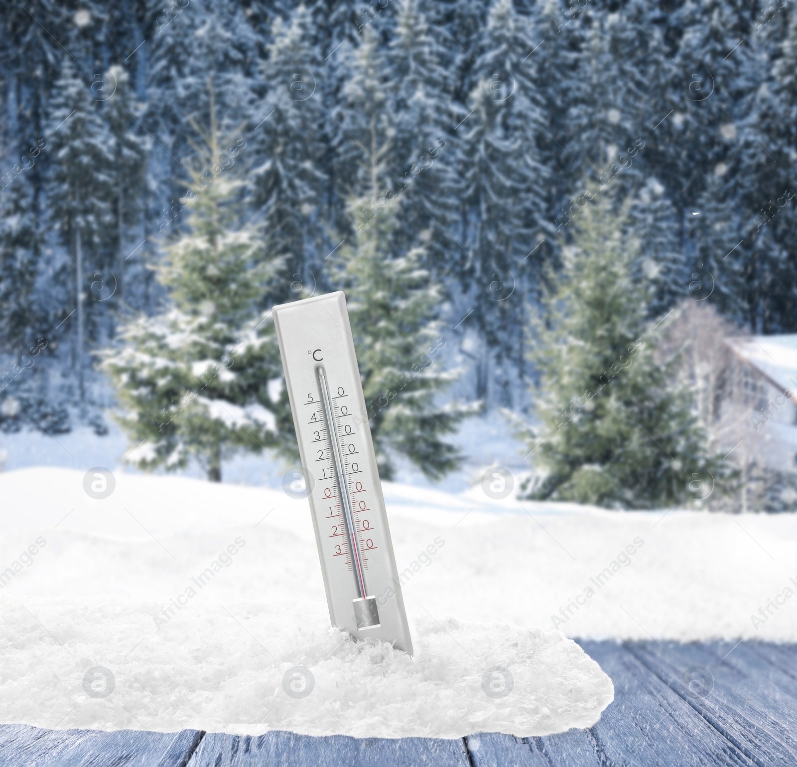 Image of Thermometer in snow showing temperature below zero outdoors on winter day