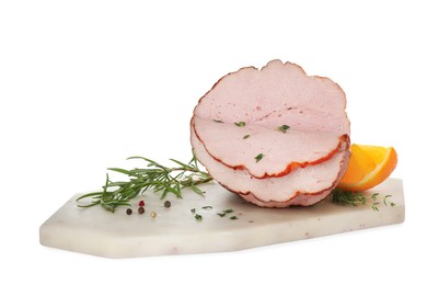 Photo of Delicious cut ham with herbs, orange slice and peppercorns isolated on white