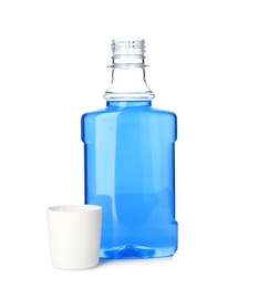 Bottle with mouthwash for teeth care on white background