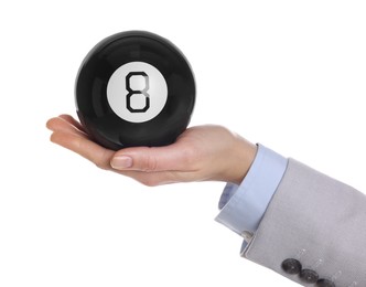 Man holding magic eight ball on white background, closeup