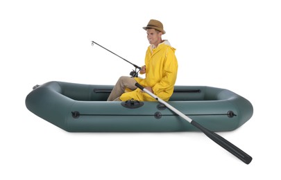 Photo of Man fishing with rod from inflatable rubber boat on white background