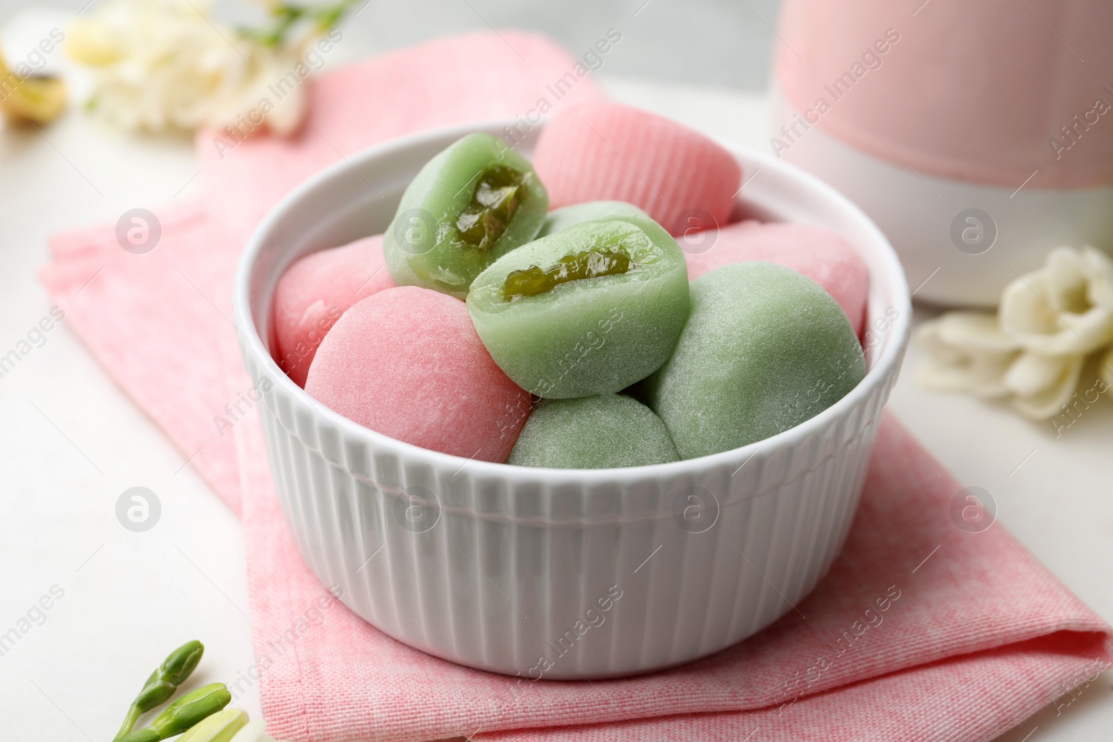 Photo of Delicious mochi in bowl on table. Traditional Japanese dessert