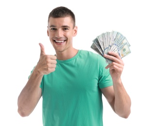 Handsome young man with dollars on white background