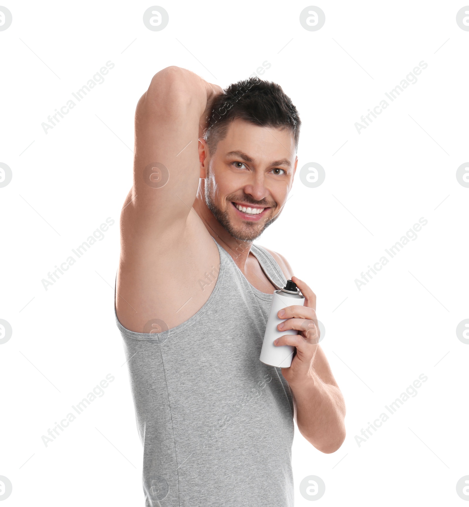 Photo of Handsome man applying deodorant isolated on white