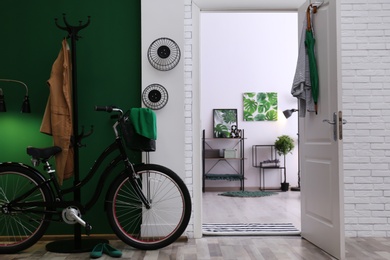 Photo of Stylish hallway with modern bicycle. Idea for interior decor