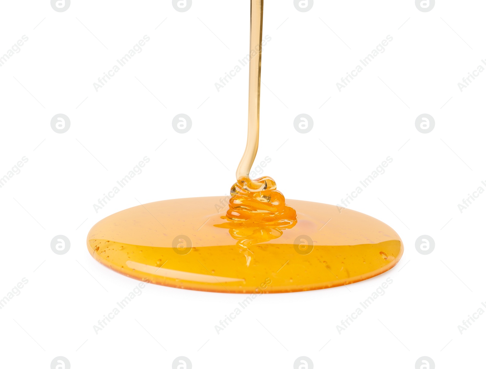 Photo of Pouring tasty natural honey isolated on white