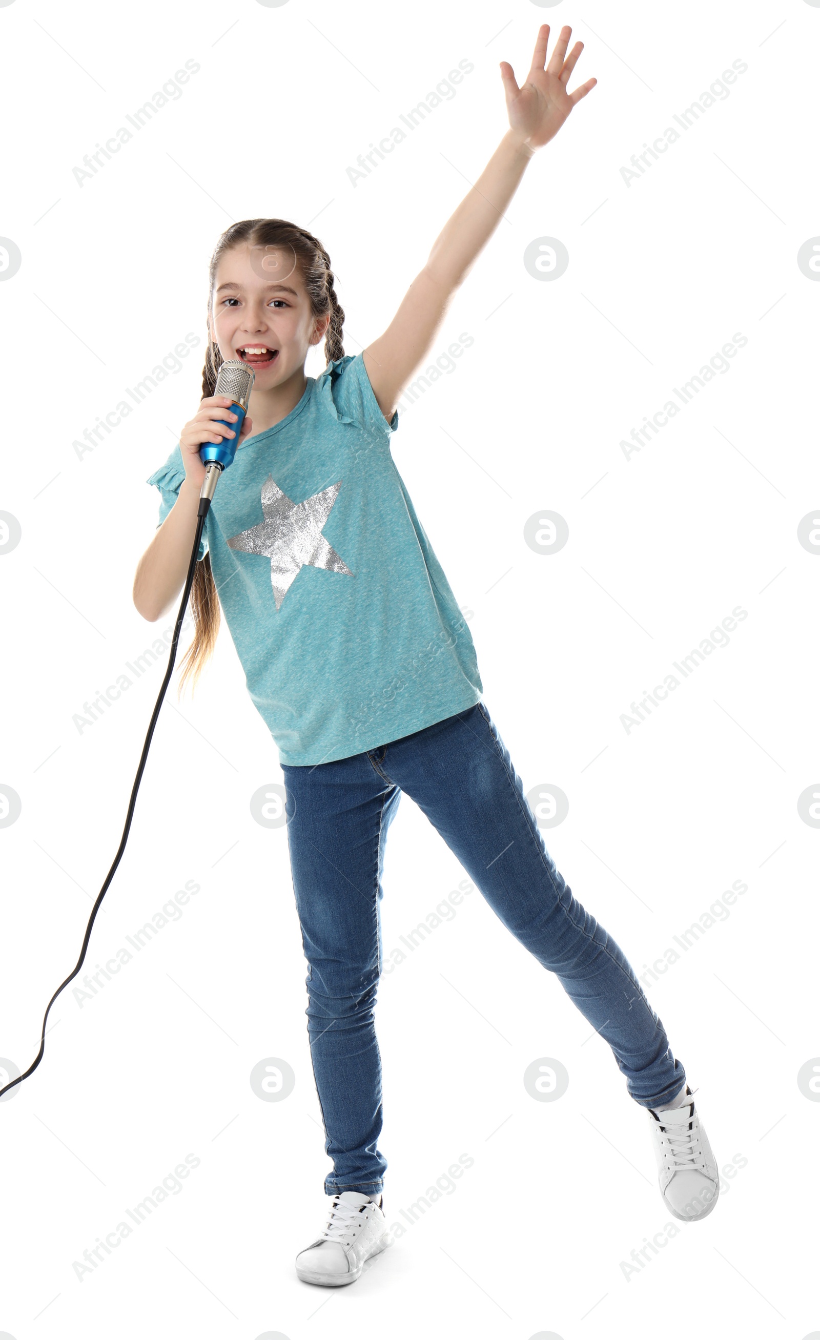 Photo of Cute girl singing in microphone on white background