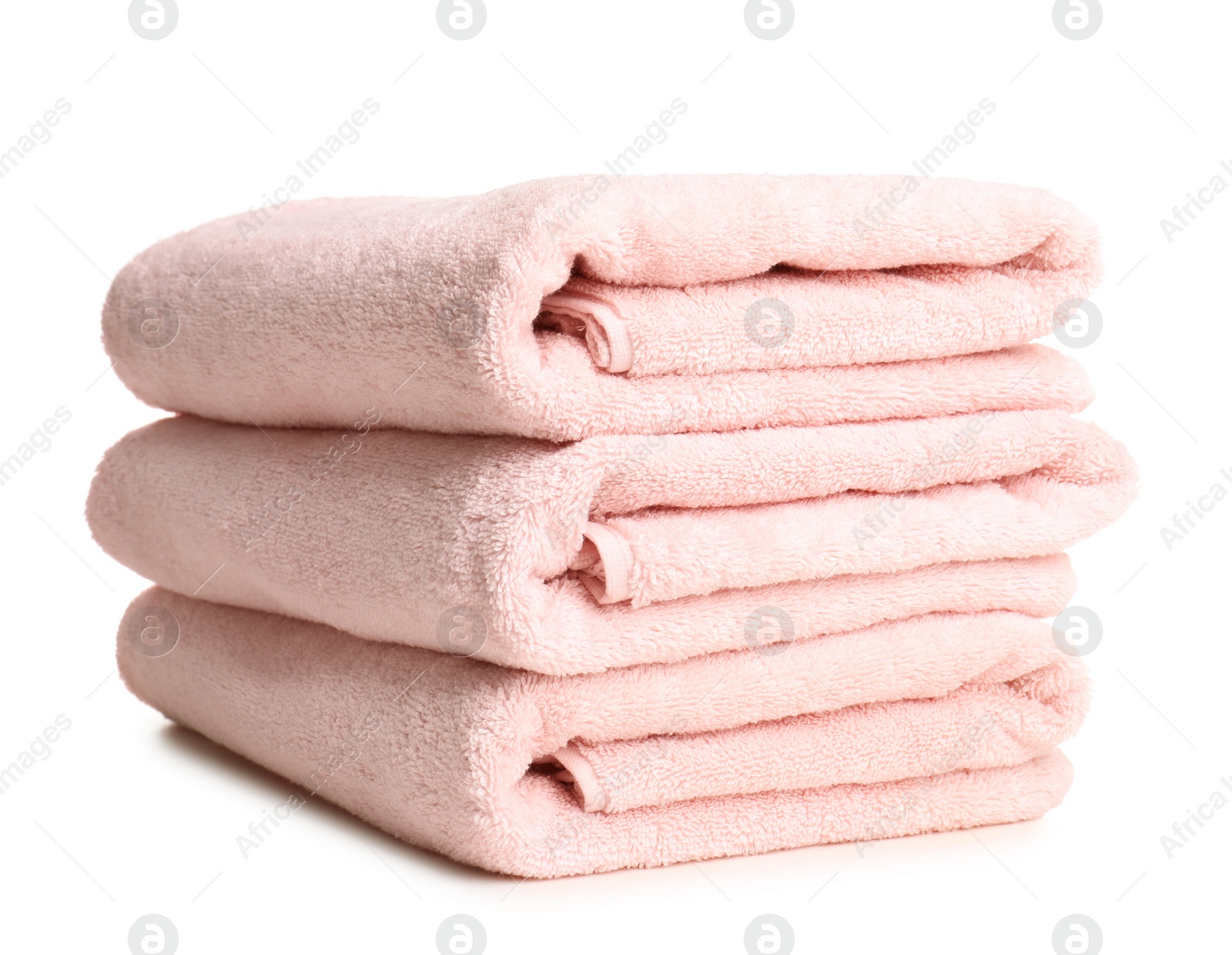 Photo of Folded soft terry towels on white background