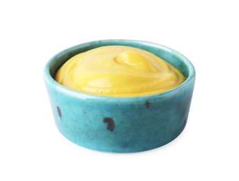 Bowl with delicious mustard on white background