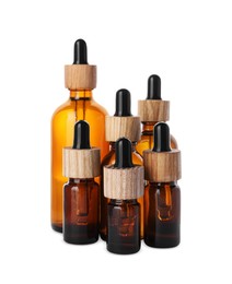 Photo of Different bottles of essential oil on white background